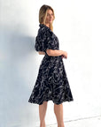 Embrace sophistication in our black scribble print cotton midi dress. Effortlessly stylish. Order now!