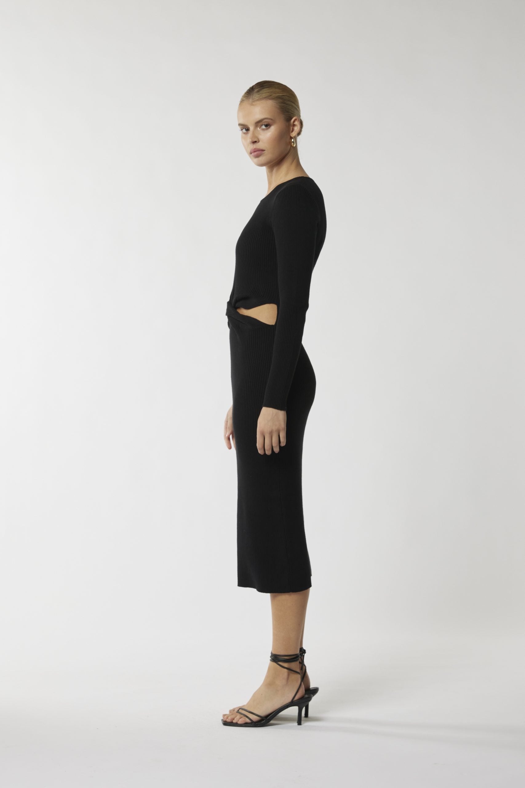 "Step into sophistication with our figure-flattering black midi dress. Perfect for any occasion!"