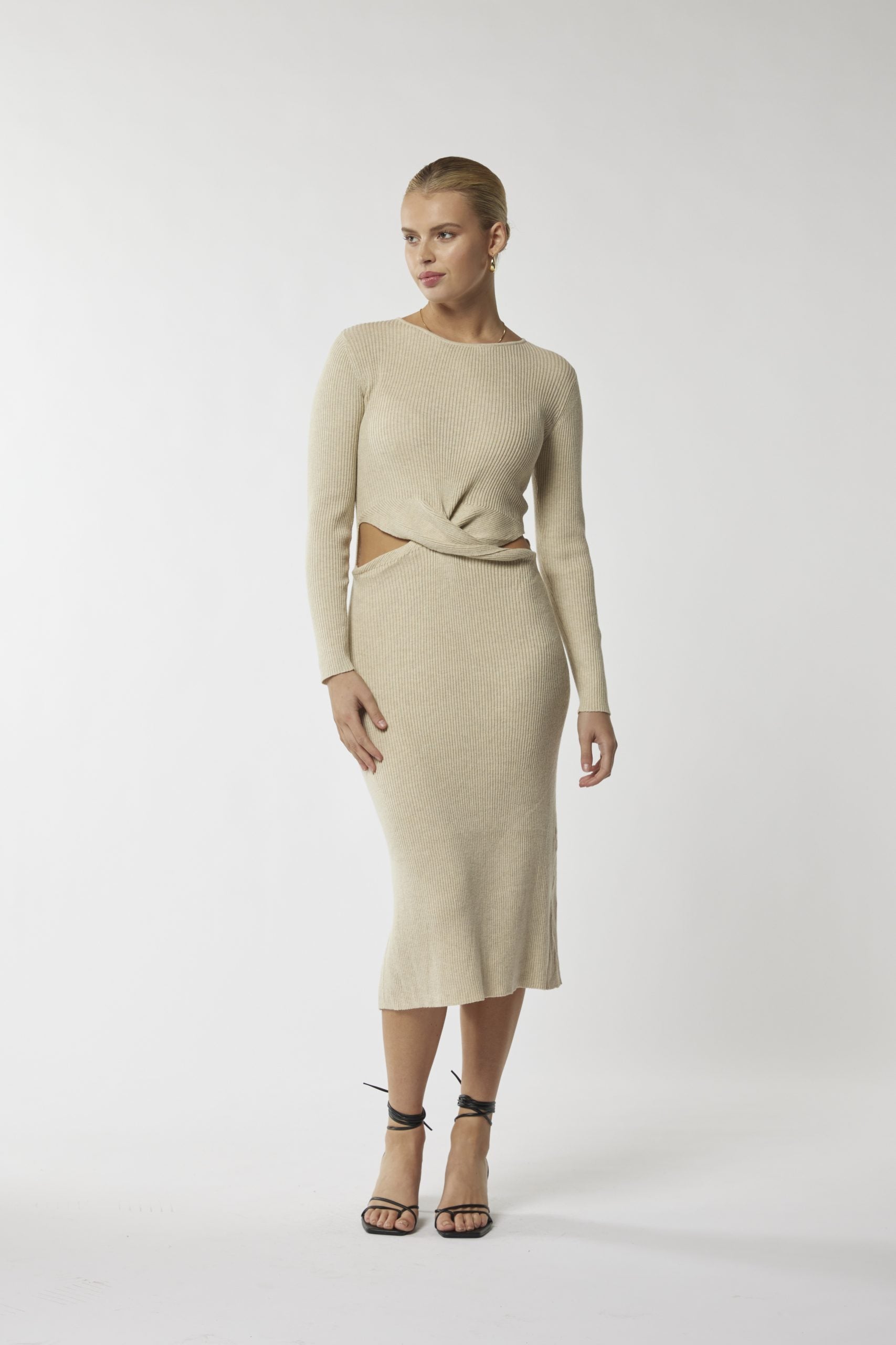 Chic sophistication: Beige midi with waist cut-out. Unbeatable style awaits!