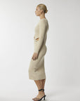 Effortless allure: Beige midi with waist cut-out. Shop the look today!