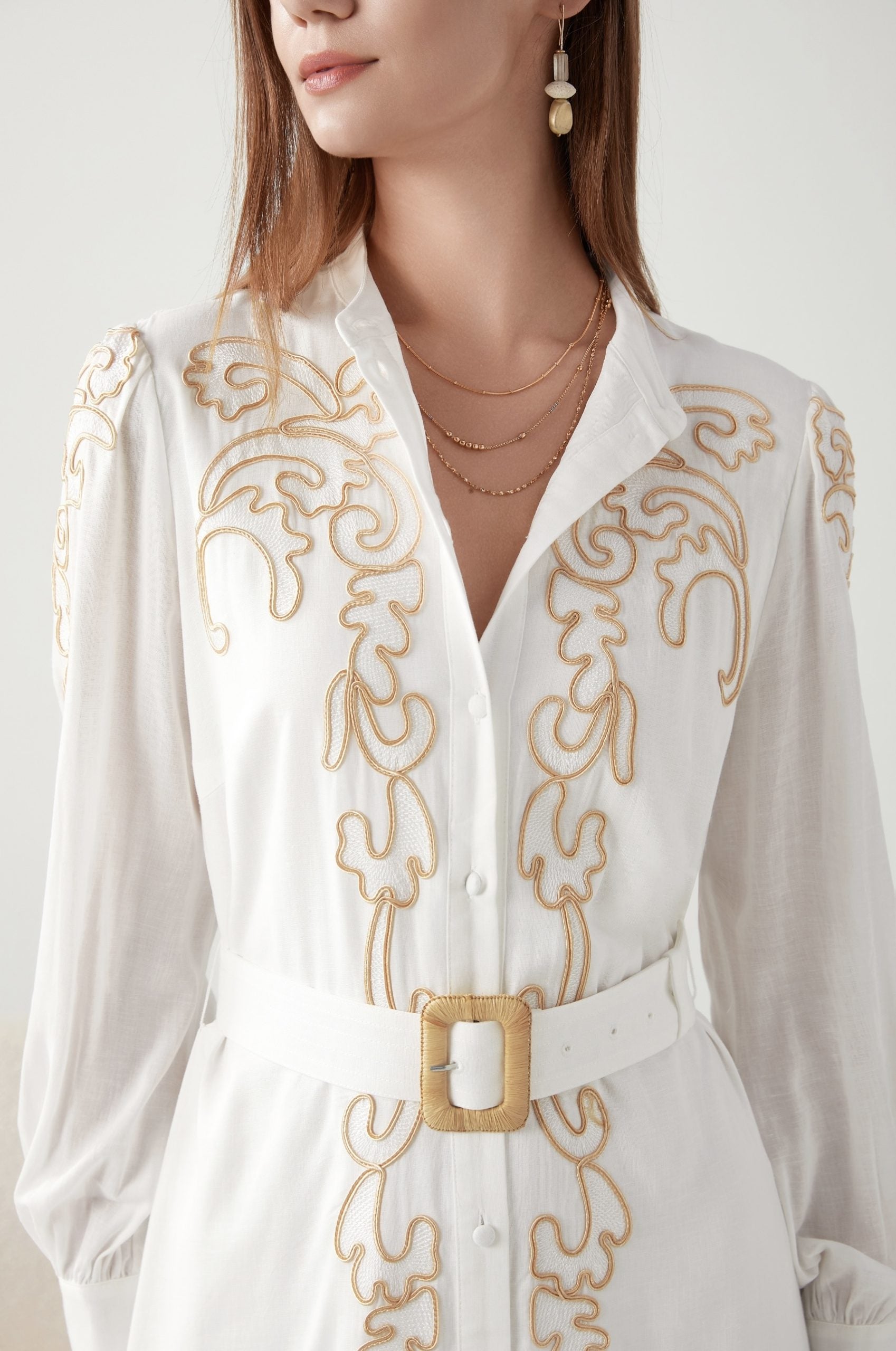 &quot;Embrace sophistication: White dress with exquisite embroidery. Get yours today!&quot;