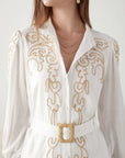 "Embrace sophistication: White dress with exquisite embroidery. Get yours today!"
