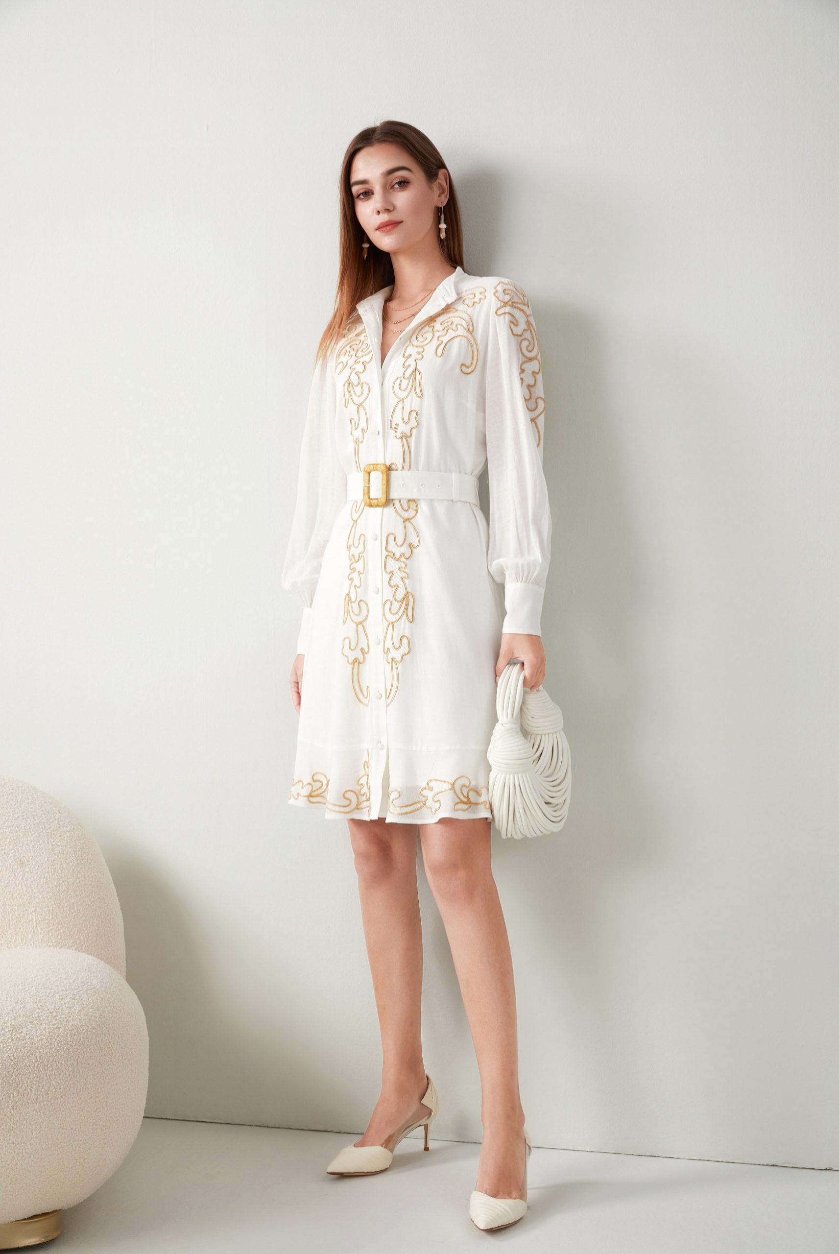 "Effortlessly chic: Short white dress adorned with delicate embroidery. Shop now!"