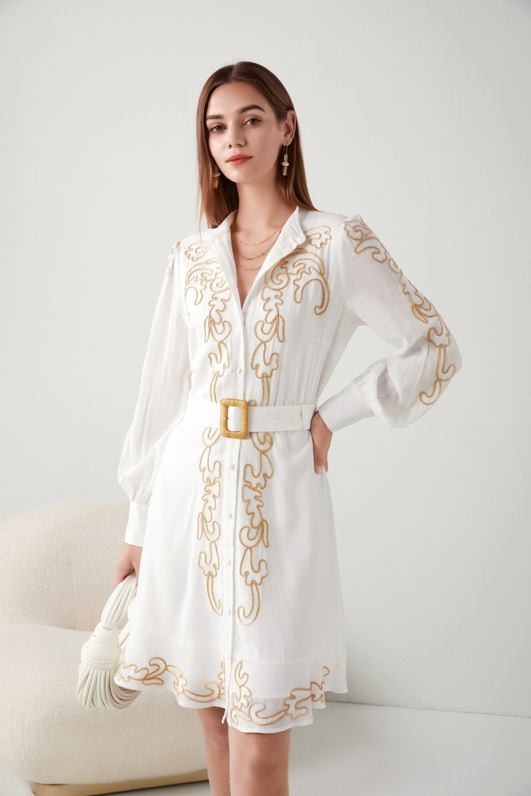 "Elevate elegance: Short white dress with intricate embroidery. Shop now for timeless style!