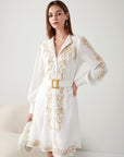 "Elevate elegance: Short white dress with intricate embroidery. Shop now for timeless style!