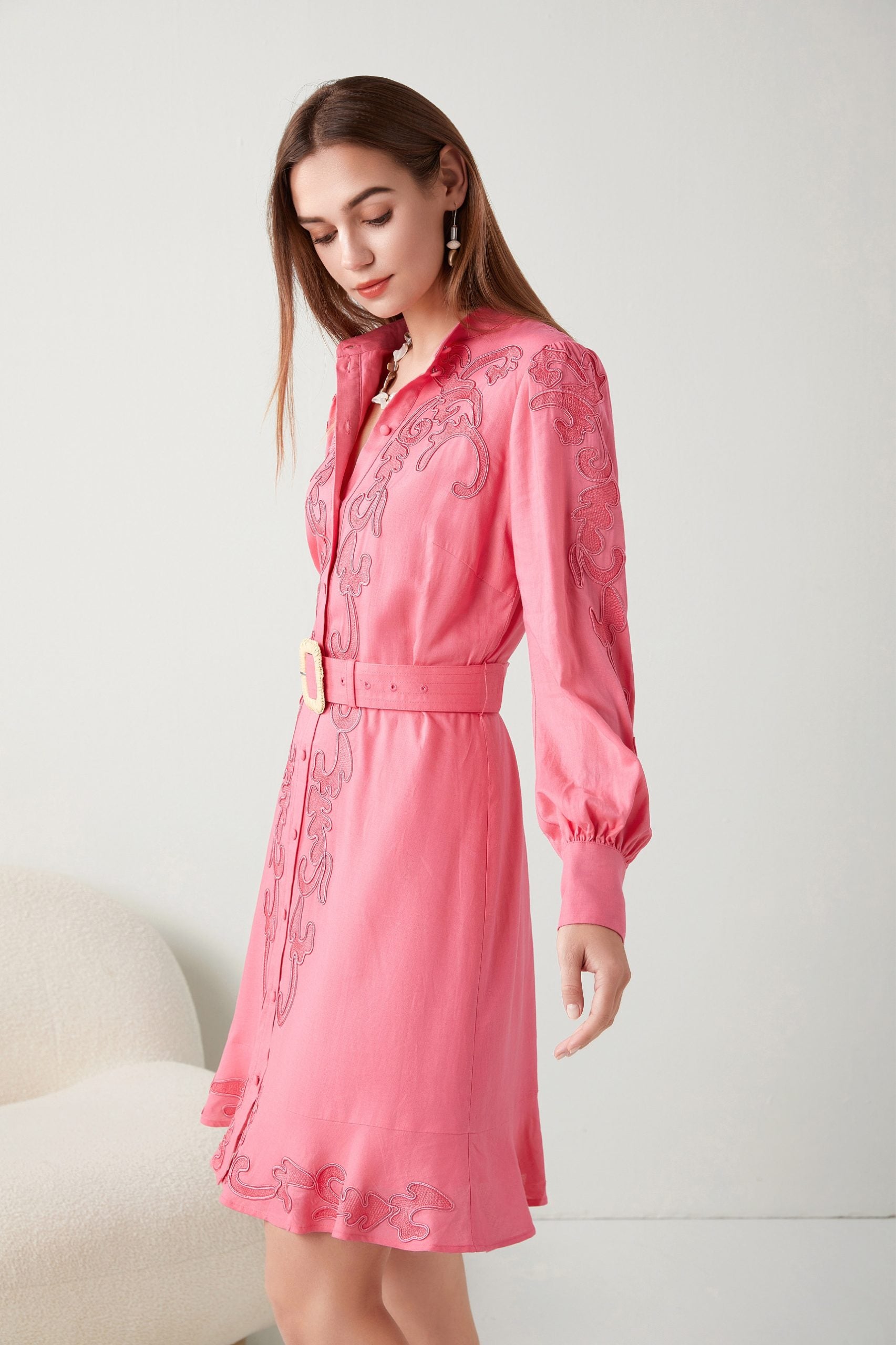 "Make a statement in pink! Our floral-embroidered dress is the epitome of chic sophistication. Discover your new favorite."