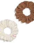 "Upgrade your hair game with Kooshoo's plastic-free scrunchies. Brown & beige options, 100% eco-friendly. Shop sustainable and stylish today!"