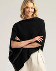 Elevate your winter wardrobe with our chic black Merino Wool Poncho. Luxurious warmth in every stitch. Buy yours today!