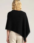 Stay cozy in style with our black Merino Wool Poncho. Perfect for chilly evenings, crafted for comfort. Shop now!