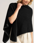 Effortless sophistication awaits with our black Merino Wool Poncho. Versatile, cozy, and irresistibly stylish. Get yours now!