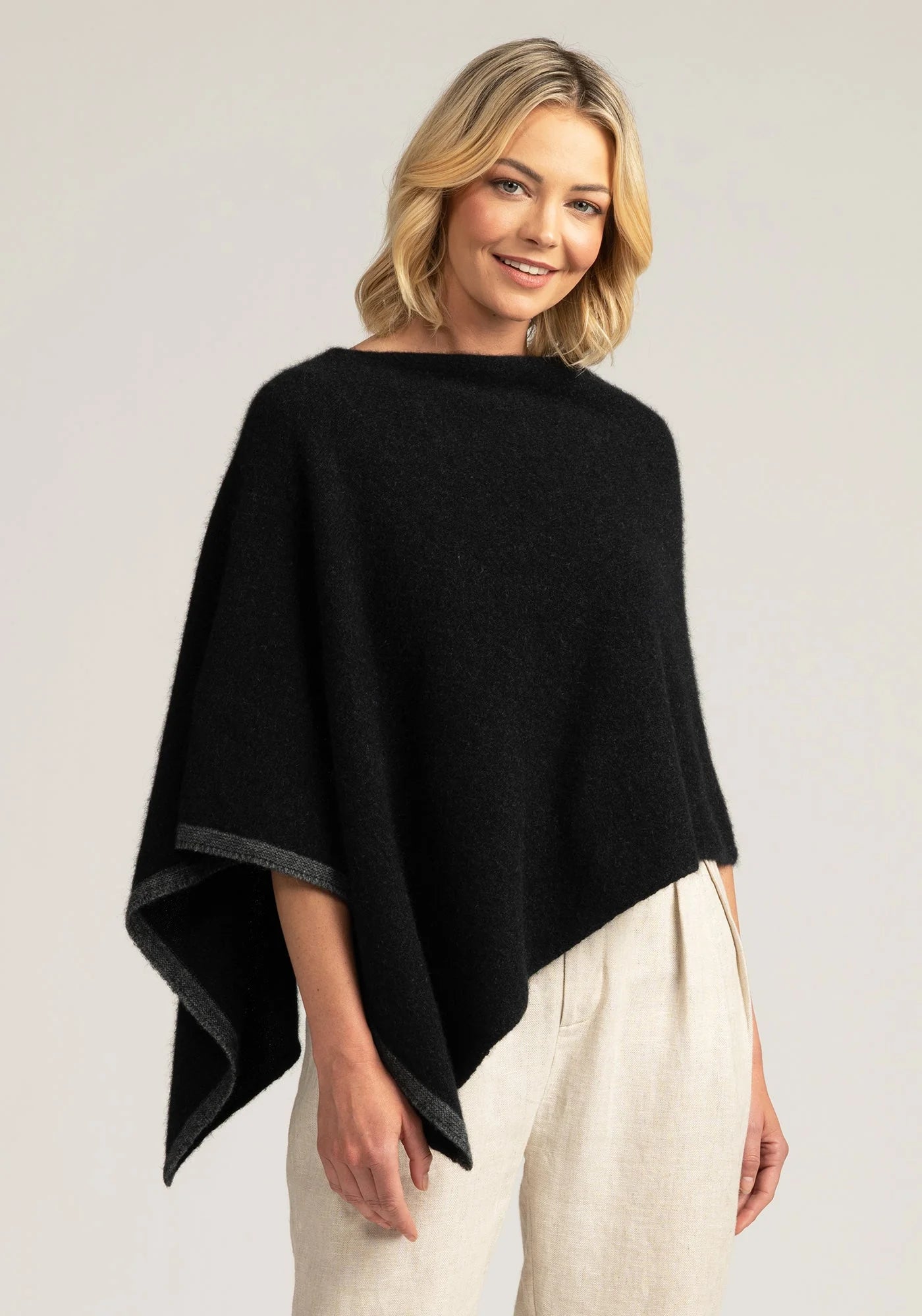 Wrap yourself in elegance with our black Merino Wool Poncho. Timeless fashion meets supreme comfort. Order now!