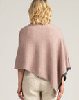 Wrap yourself in luxury with our light pink merino wool poncho. Elegant comfort for any occasion. Order yours today!