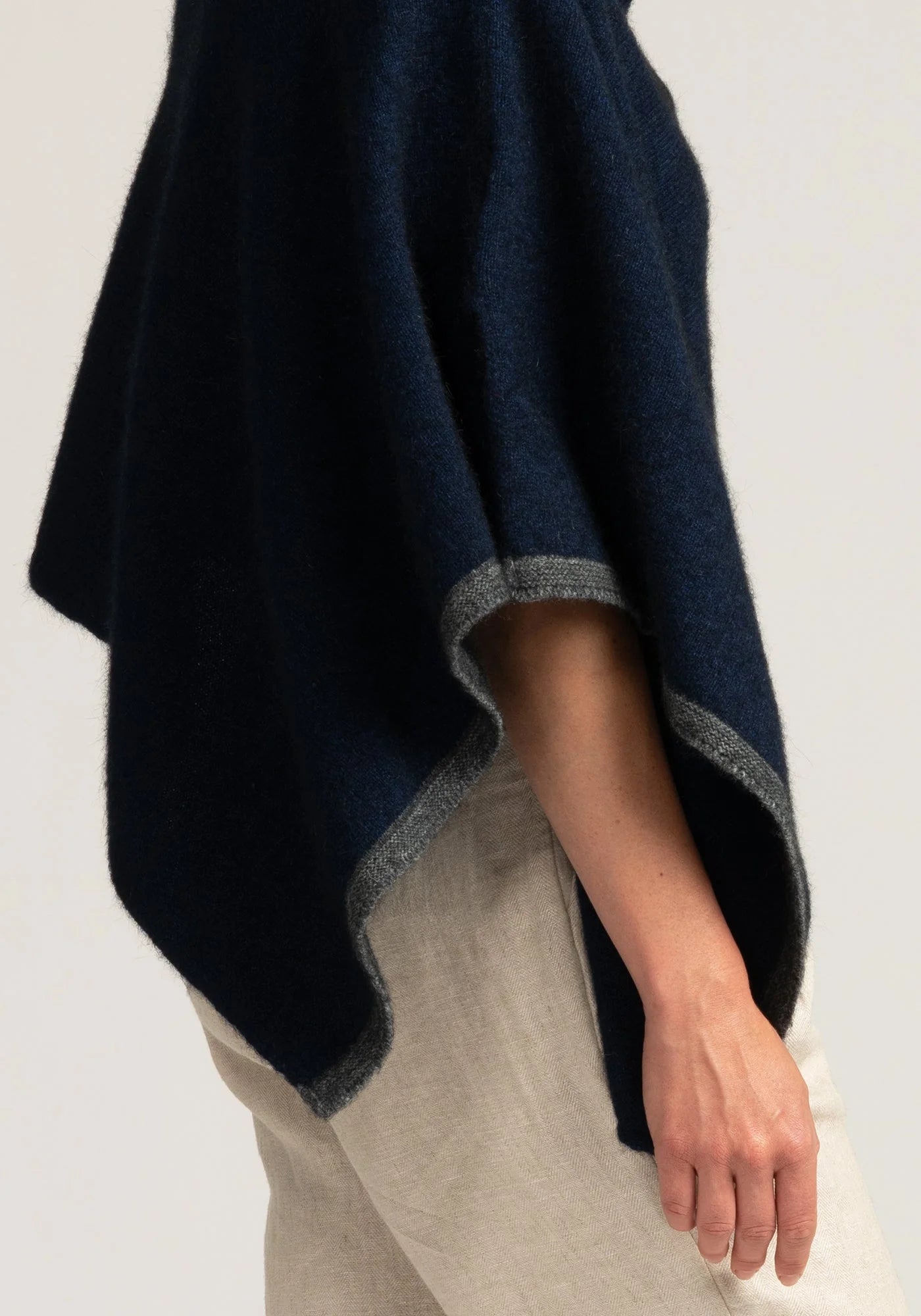 Elevate your look with our navy blue merino wool poncho. Unmatched comfort meets sophisticated design. Buy now!