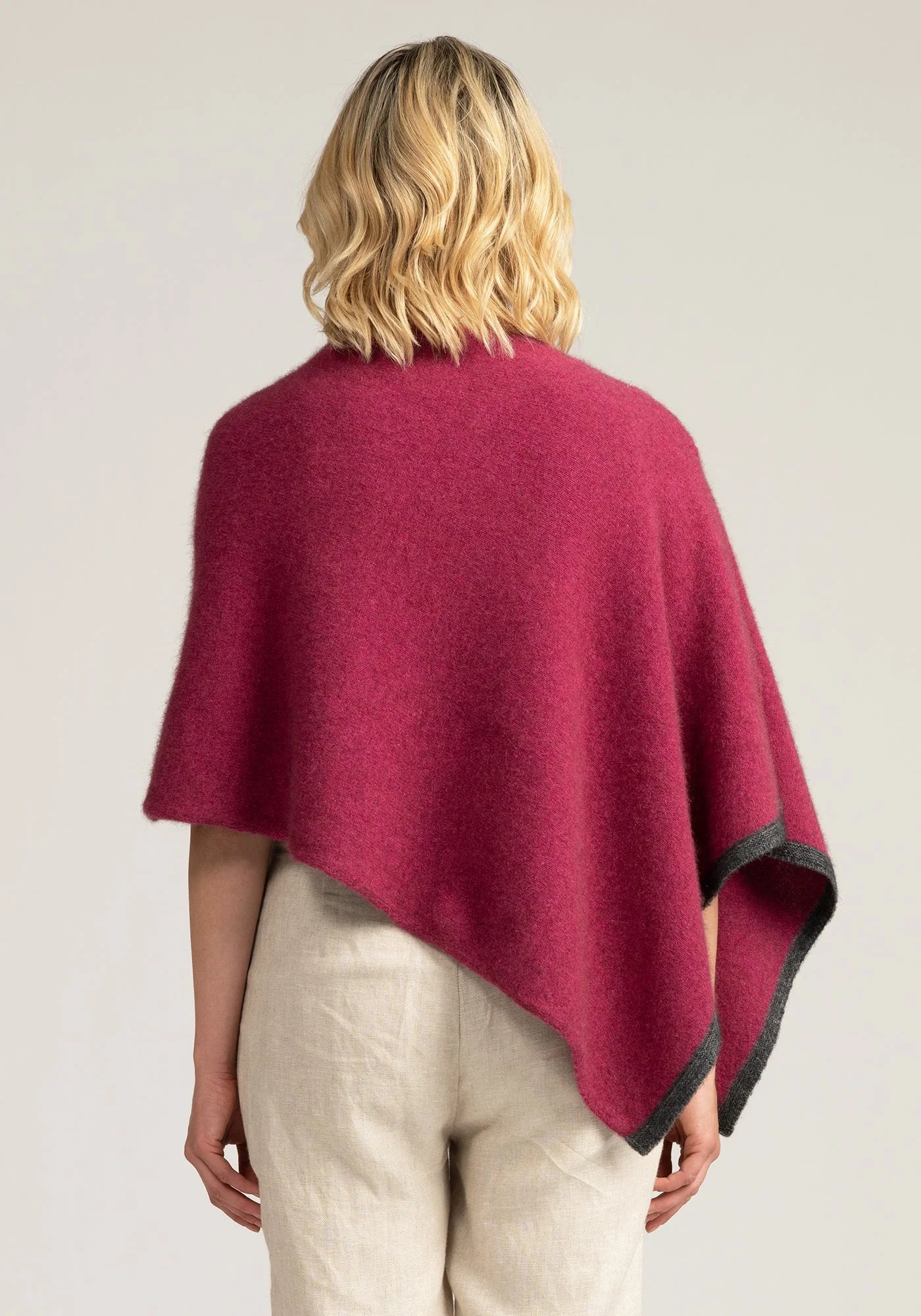 Elevate your style with our Pink Merino Wool Poncho. Soft, warm, and oh-so-stylish. Shop now!