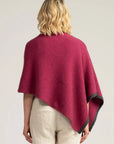 Elevate your style with our Pink Merino Wool Poncho. Soft, warm, and oh-so-stylish. Shop now!