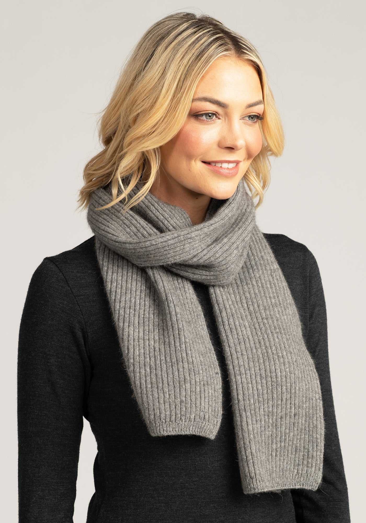 Wrap up in luxury with our grey merino wool ribbed scarf. Soft, stylish, and perfect for chilly days. Shop now!