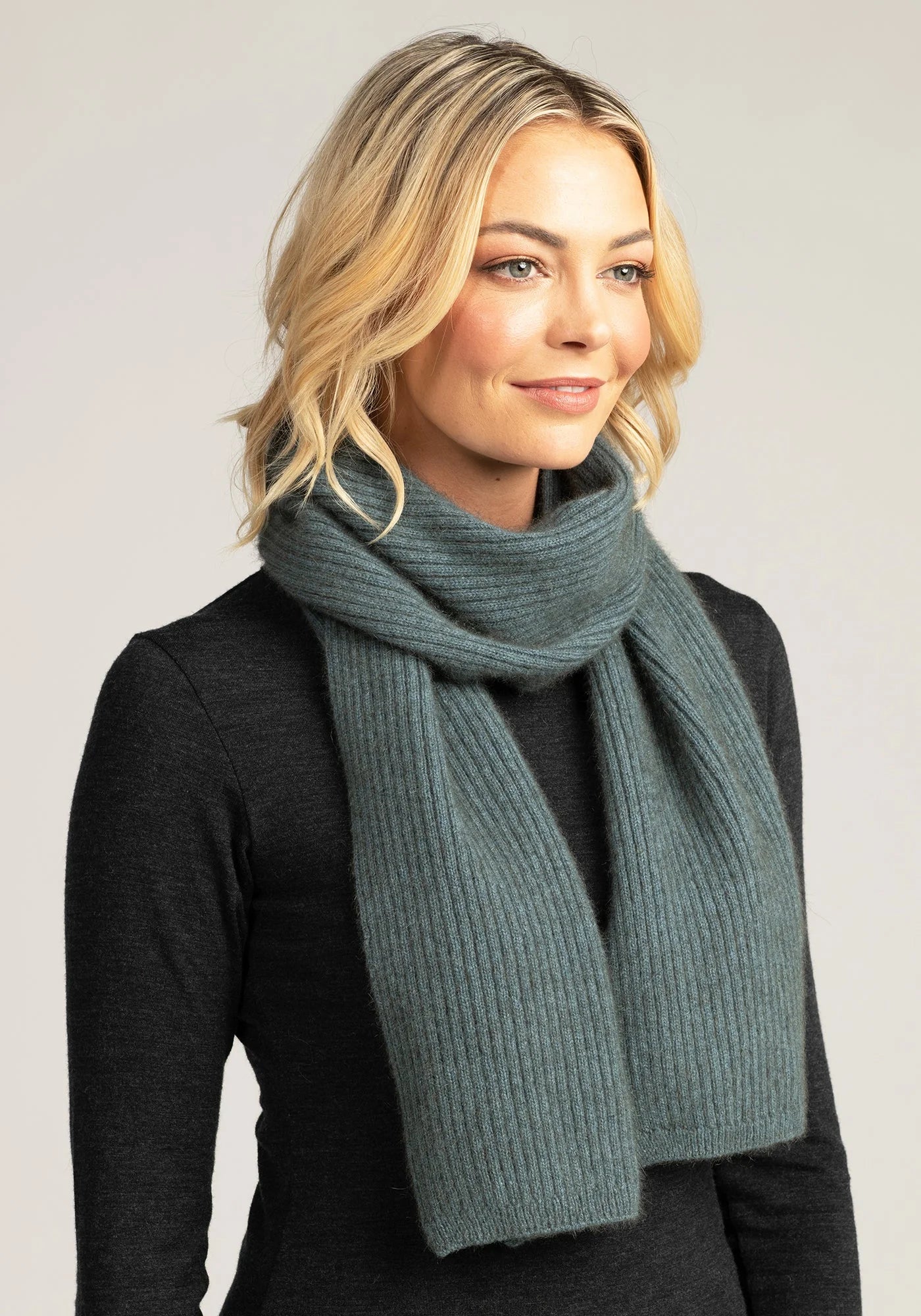 Elevate your winter wardrobe with our grey merino wool ribbed scarf. Warmth meets elegance in every stitch.
