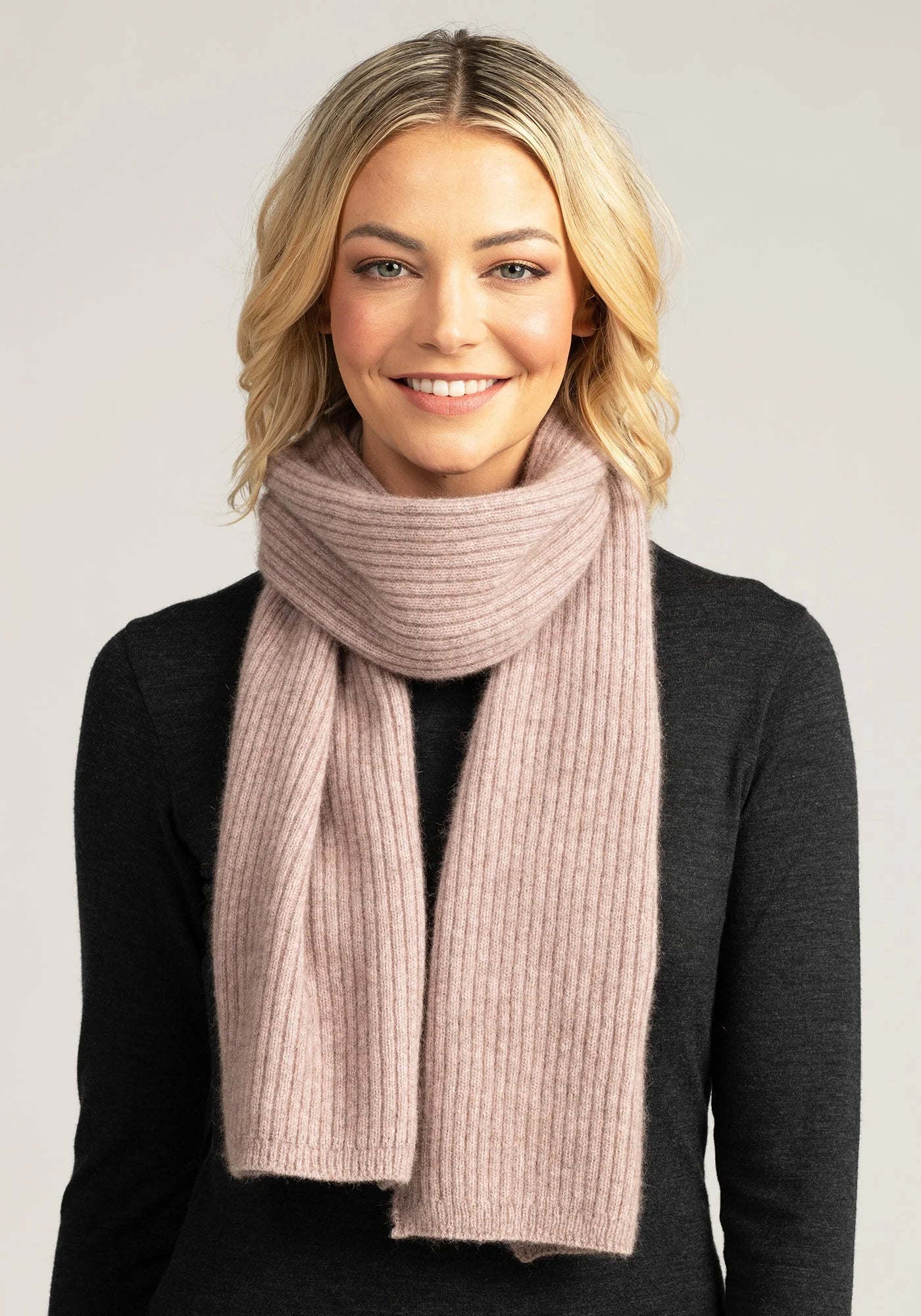 Experience ultimate comfort with our blush merino wool ribbed scarf. A must-have accessory for any wardrobe. Shop now!