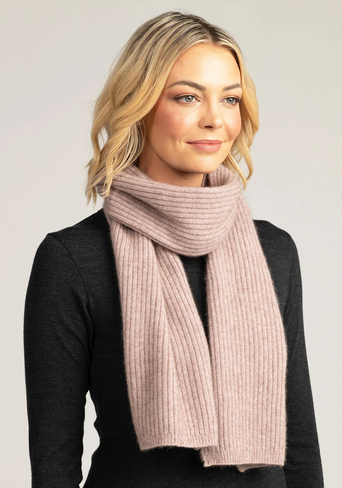 Stay warm in style with our light pink merino wool ribbed scarf. Soft, breathable, and irresistibly chic. Order now!