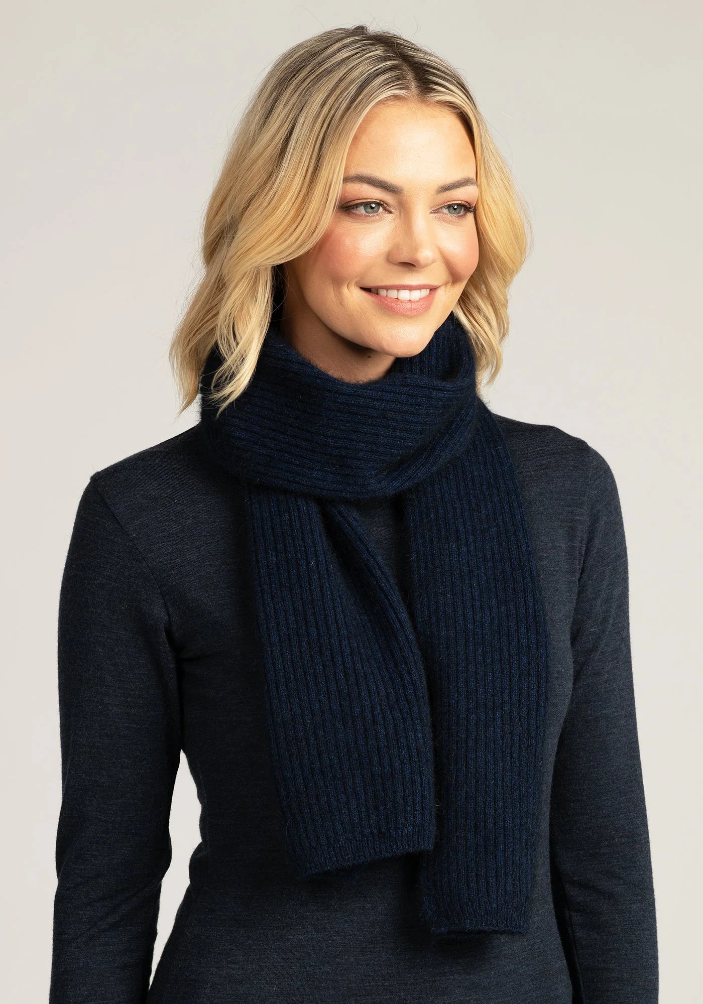 Bundle up in sophistication with our blue merino wool ribbed scarf. Luxuriously soft and endlessly versatile. Shop today!