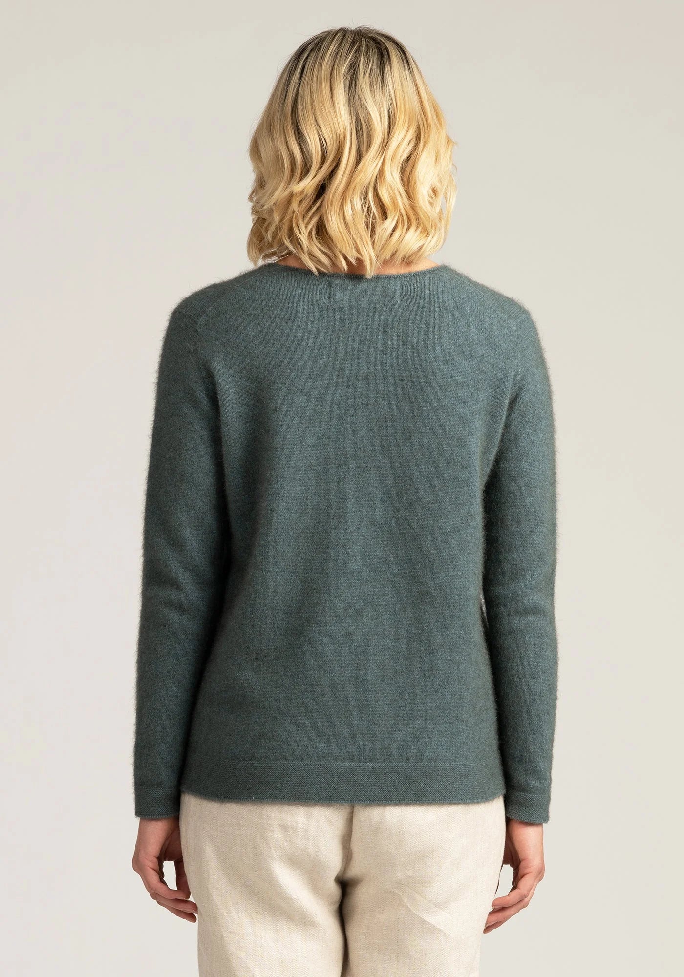 "Stay cozy in our luxurious merino wool grey sweater. Effortless style meets ultimate comfort. Shop now!"