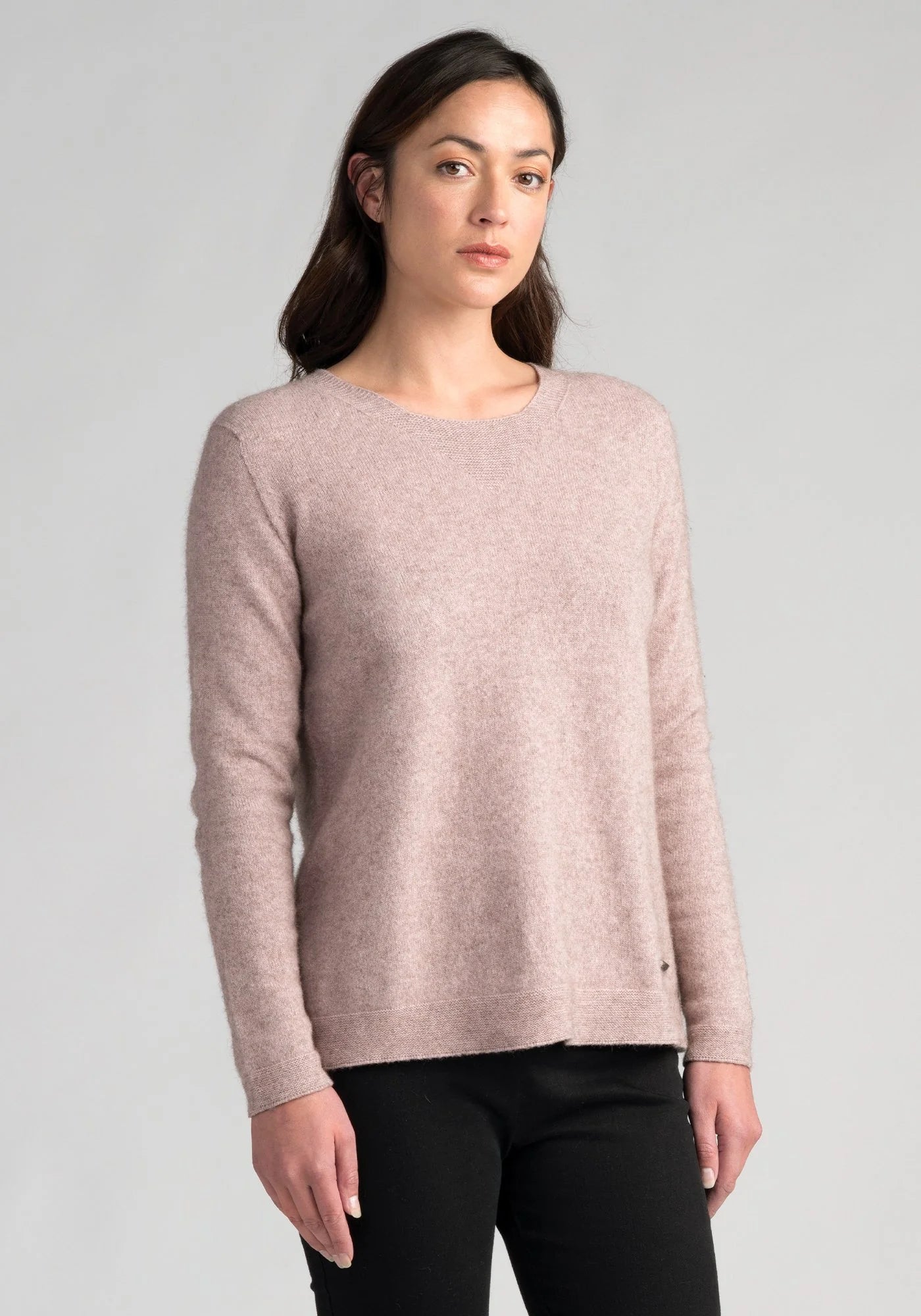 "Wrap yourself in luxury with our light blush pink merino wool sweater. Effortless elegance awaits."