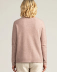 "Indulge in warmth and sophistication with our blush pink merino wool sweater. Shop the look today!"