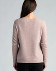 "Stay cozy in style with our blush pink merino wool sweater. Soft, chic, and irresistible. Shop now!"