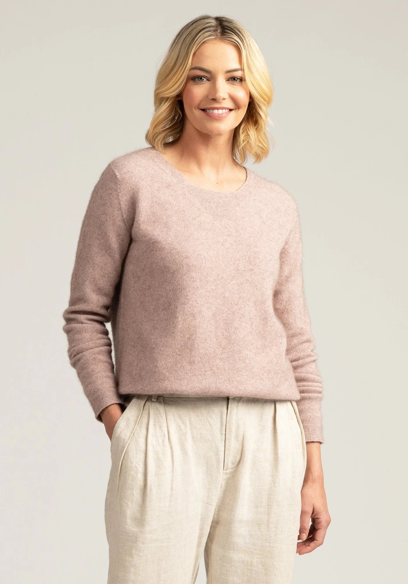 "Experience bliss in blush pink with our merino wool sweater. Your perfect blend of comfort and style."