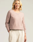 "Experience bliss in blush pink with our merino wool sweater. Your perfect blend of comfort and style."