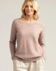 "Upgrade your knitwear game with our light blush pink merino wool sweater. Get yours now!"