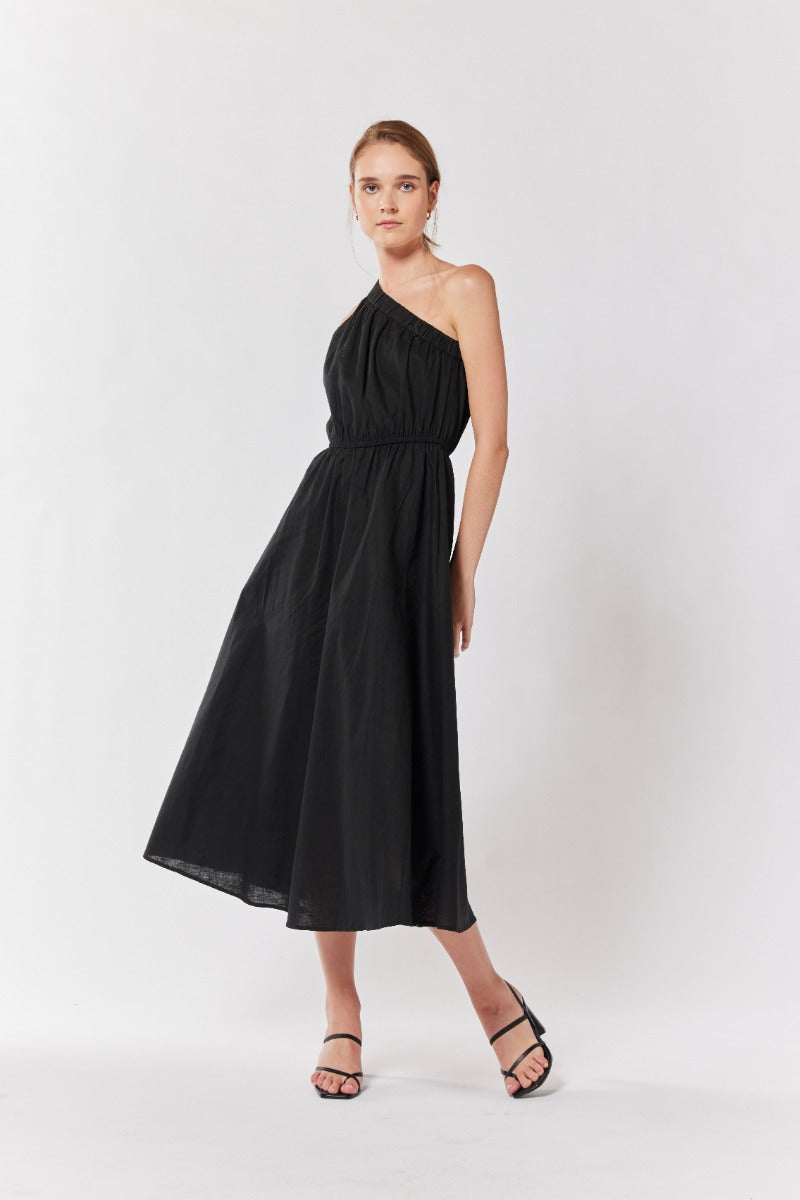 "Instant allure: Elevate your wardrobe with a stunning black one-shoulder dress."