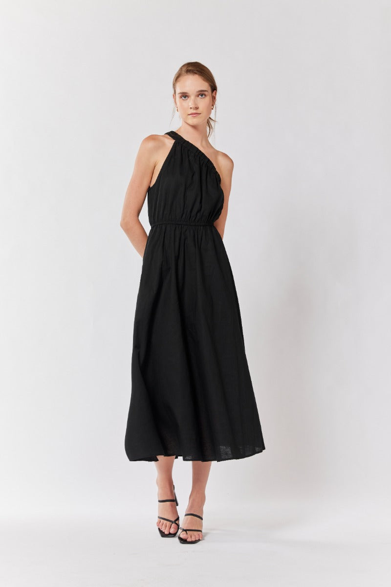 "Unleash your inner glam: Black one-shoulder dress, the epitome of elegance."