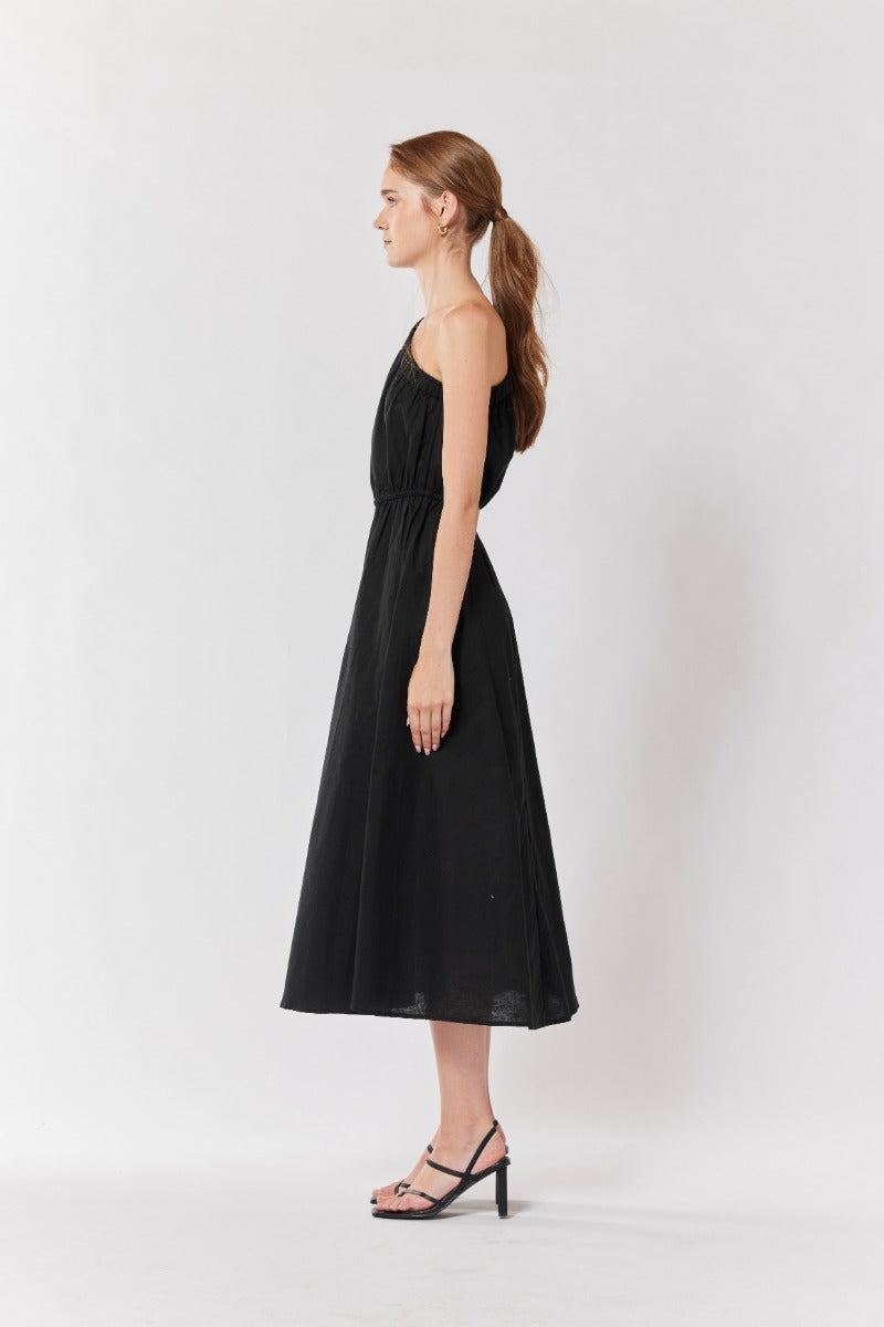 "Effortless glamour: Step out in style with our black one-shoulder dress."