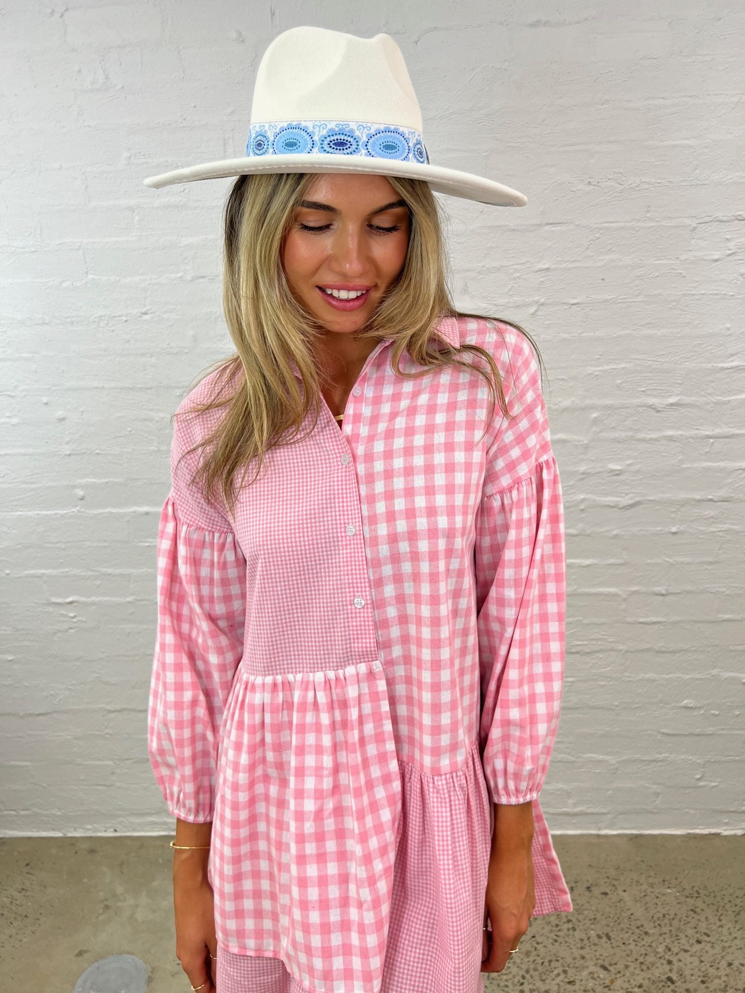 Effortless charm: Pink gingham shirt dress. Elevate your style with this versatile must-have. Shop now!