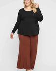 "Unwind in style with our Bamboo Relaxed Top in Black. Effortless comfort, timeless appeal."