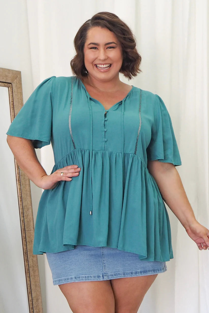 Teal allure for curves! Step into our plus-size babydoll top for a look that wows. Embrace style, embrace you. Order today!