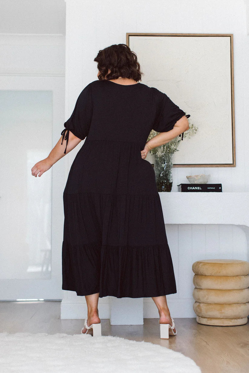 Find the ideal plus-size black dress to suit your curves and style. Embrace elegance with our versatile selection.
