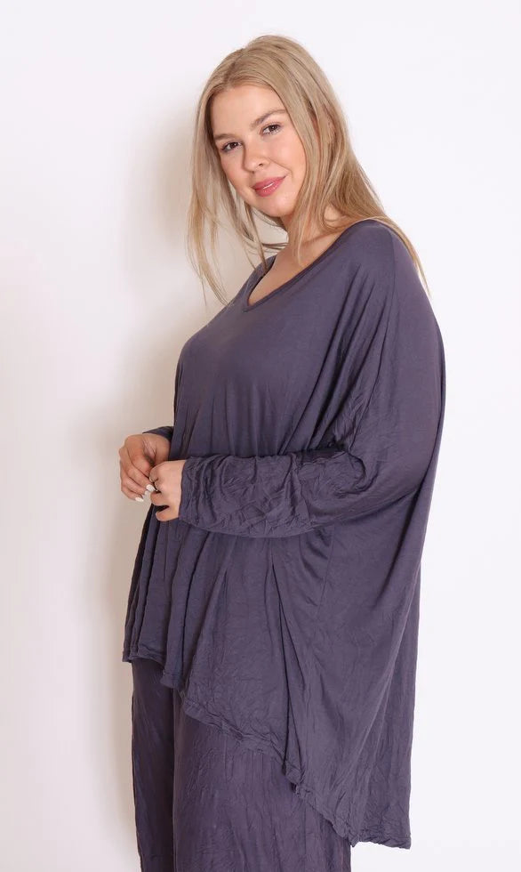 Discover the perfect blend of style and comfort in our grey plus-size cotton top. Embrace fashion that fits!