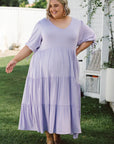 Elevate your wardrobe with our lilac plus-size flowy dress. Effortless charm for every occasion. Shop now and shine!