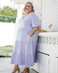 Indulge in the dreamy allure of our lilac plus-size flowy dress. Flaunt your confidence with every step. Buy now!