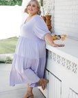 Wrap yourself in grace with our lilac plus-size flowy dress. Perfect fit for every body type. Get yours today!