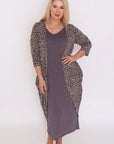 Wrap yourself in chic comfort! Plus-size long cardigan with bold leopard print. Elevate your style effortlessly