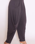 "Discover the allure of our grey drape pants! Tailored for plus sizes, these loose-fit essentials promise style without compromise. Shop now!"