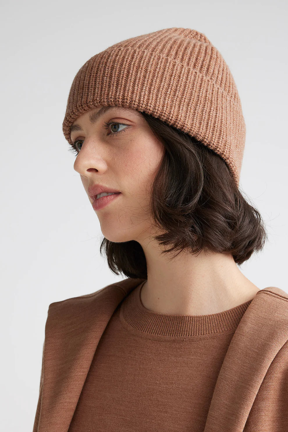Elevate your winter look with our ribbed wool beanie. Soft, snug, and effortlessly chic. Buy yours today!