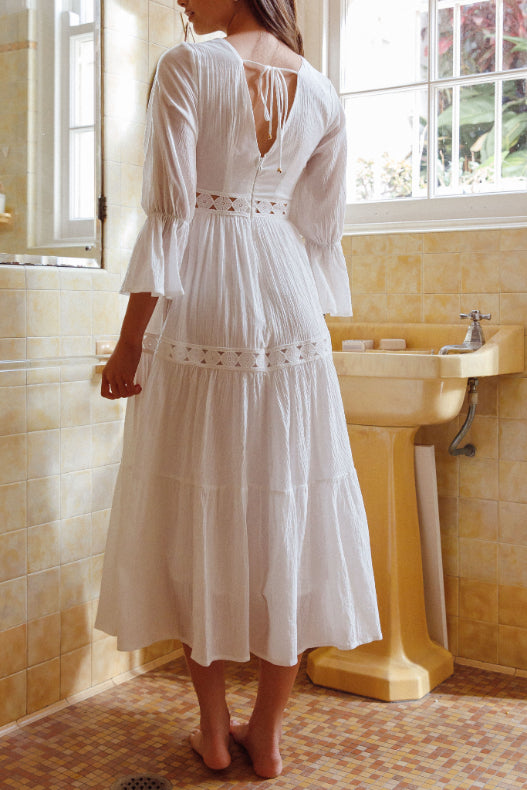 Experience breezy sophistication in our white cotton midi dress. Shop now and shine!
