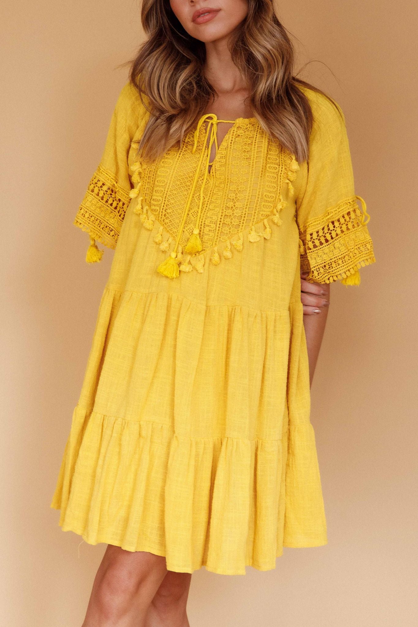 "Turn heads in our yellow midi dress! Effortless elegance for any occasion."
